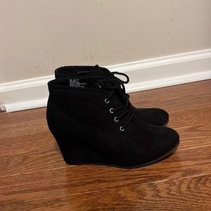 Used-laced black booties
